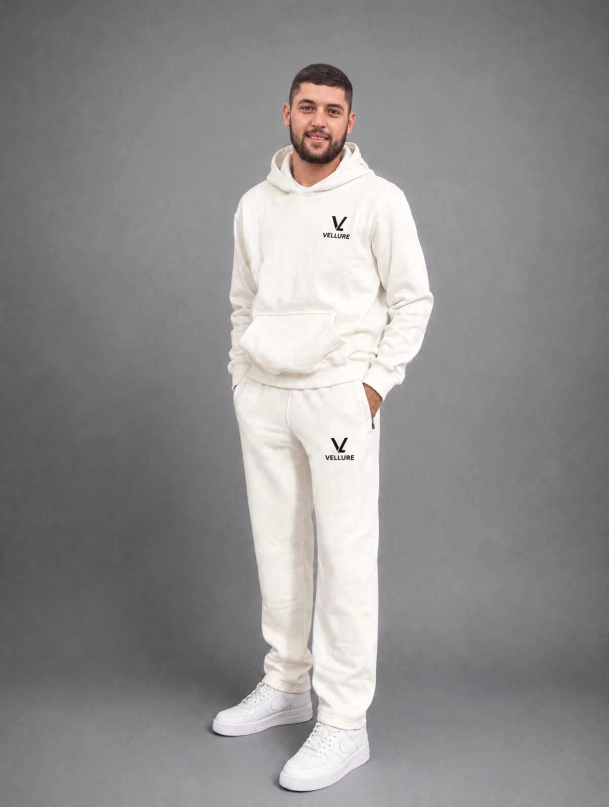Tom, known as Rico, wearing his cream VELLURE tracksuit