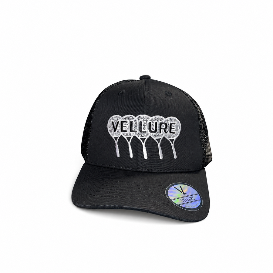 Black VELLURE Signature Tennis Trucker Cap on a plain white background